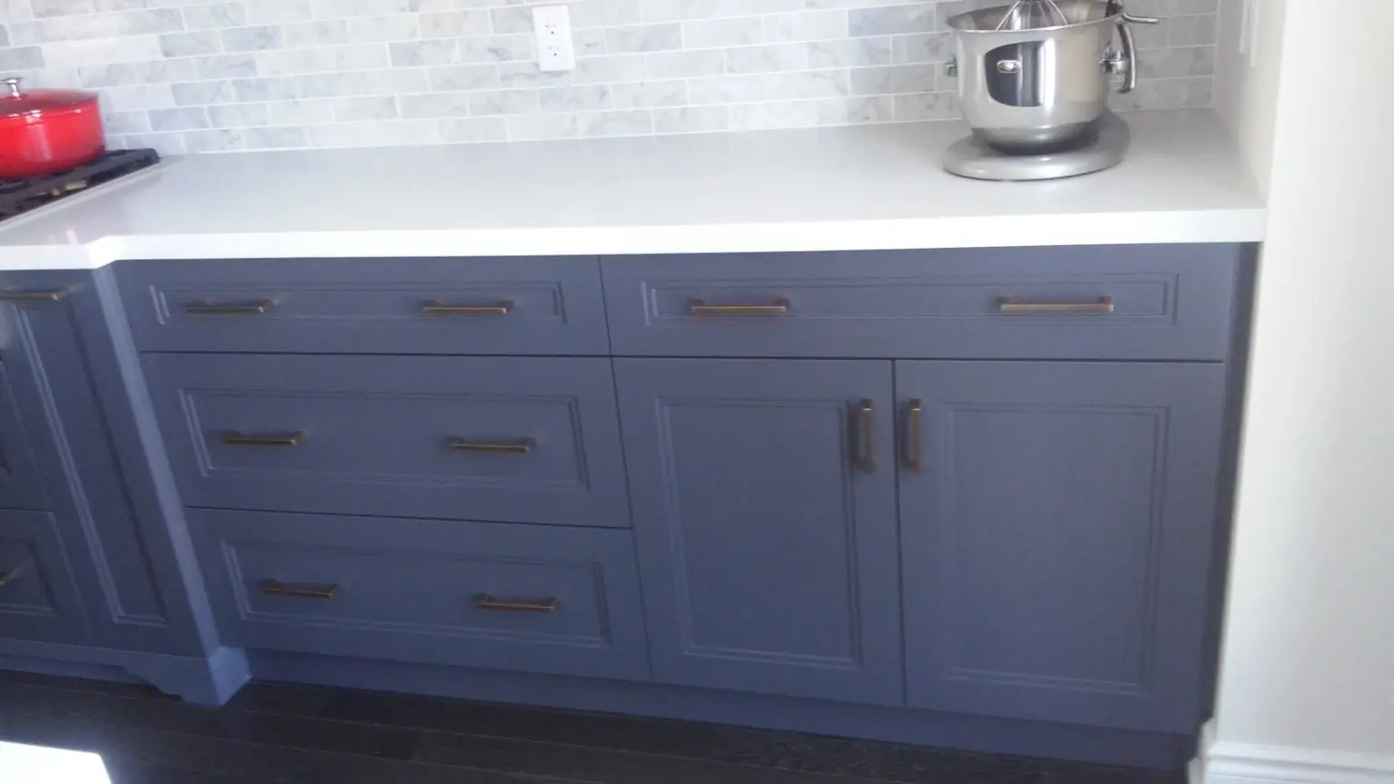 Clean kitchen cabinets during weekly home cleaning in Pickering