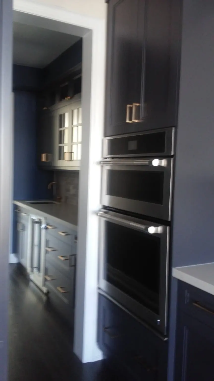 Clean built-in kitchen appliances during move-in cleaning in Pickering