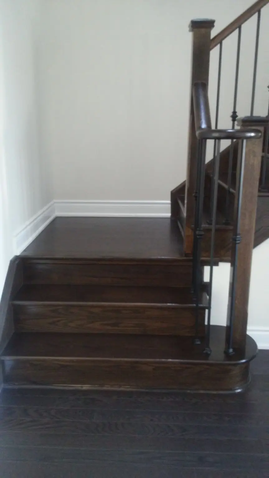 Clean hardwood staircase during weekly recurring cleaning in Pickering