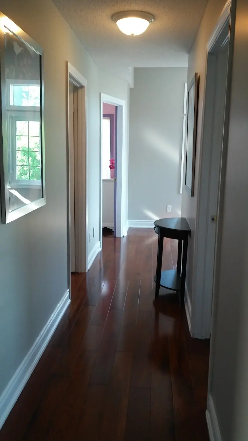 Clean hardwood hallway after a professional deep cleaning service in Ajax
