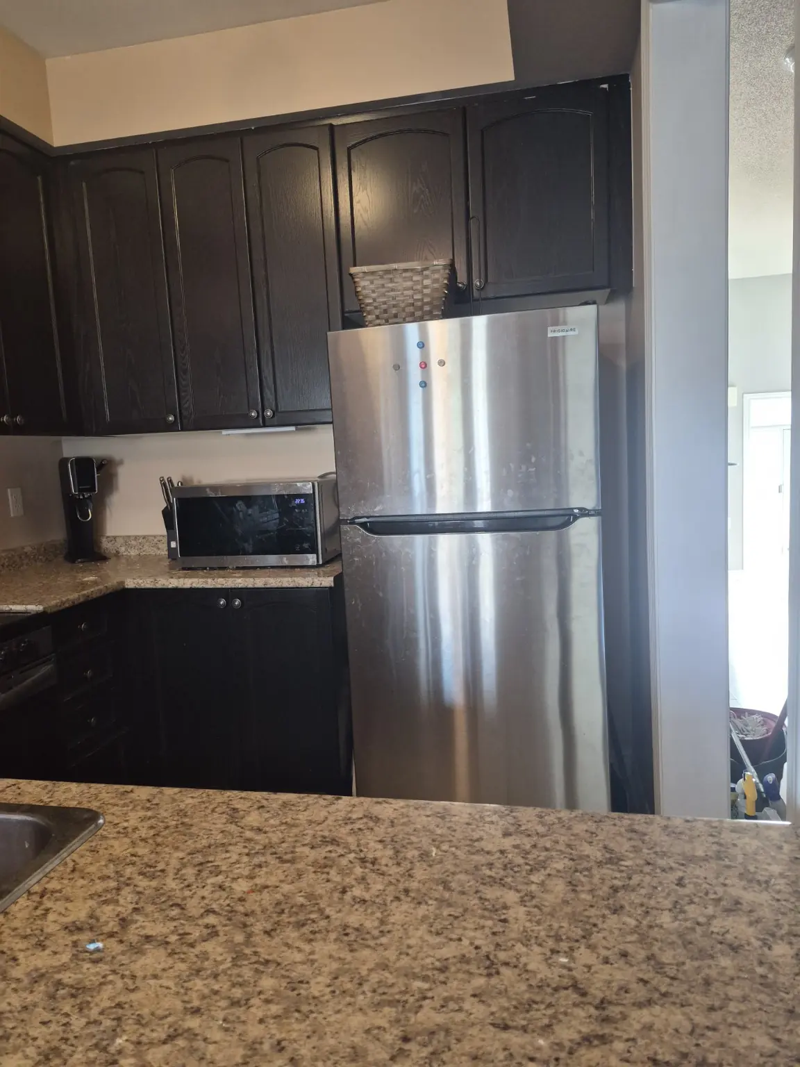 Kitchen appliances before professional deep cleaning in a Pickering home