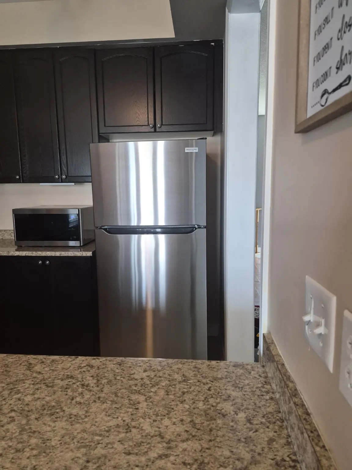 Clean refrigerator, microwave and kitchen cabinets after deep cleaning in Pickering