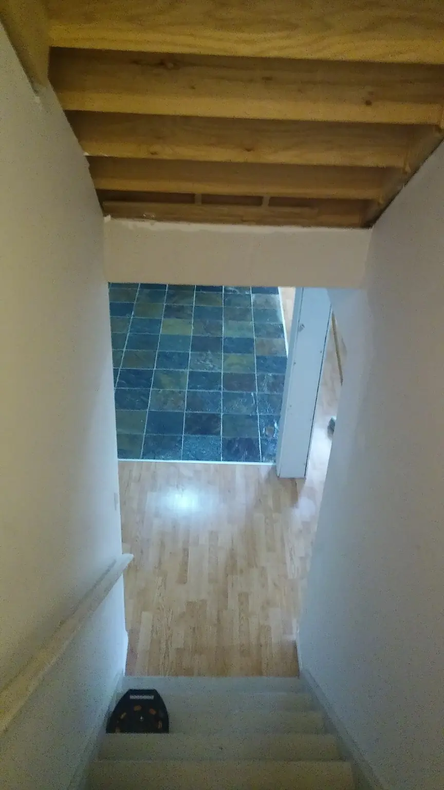Stairway and flooring before renovation cleanup service in Whitby