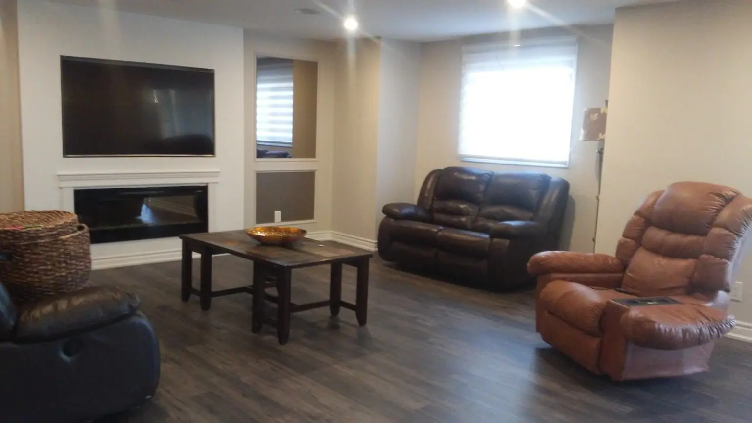 Finished basement living area after renovation cleaning in Courtice