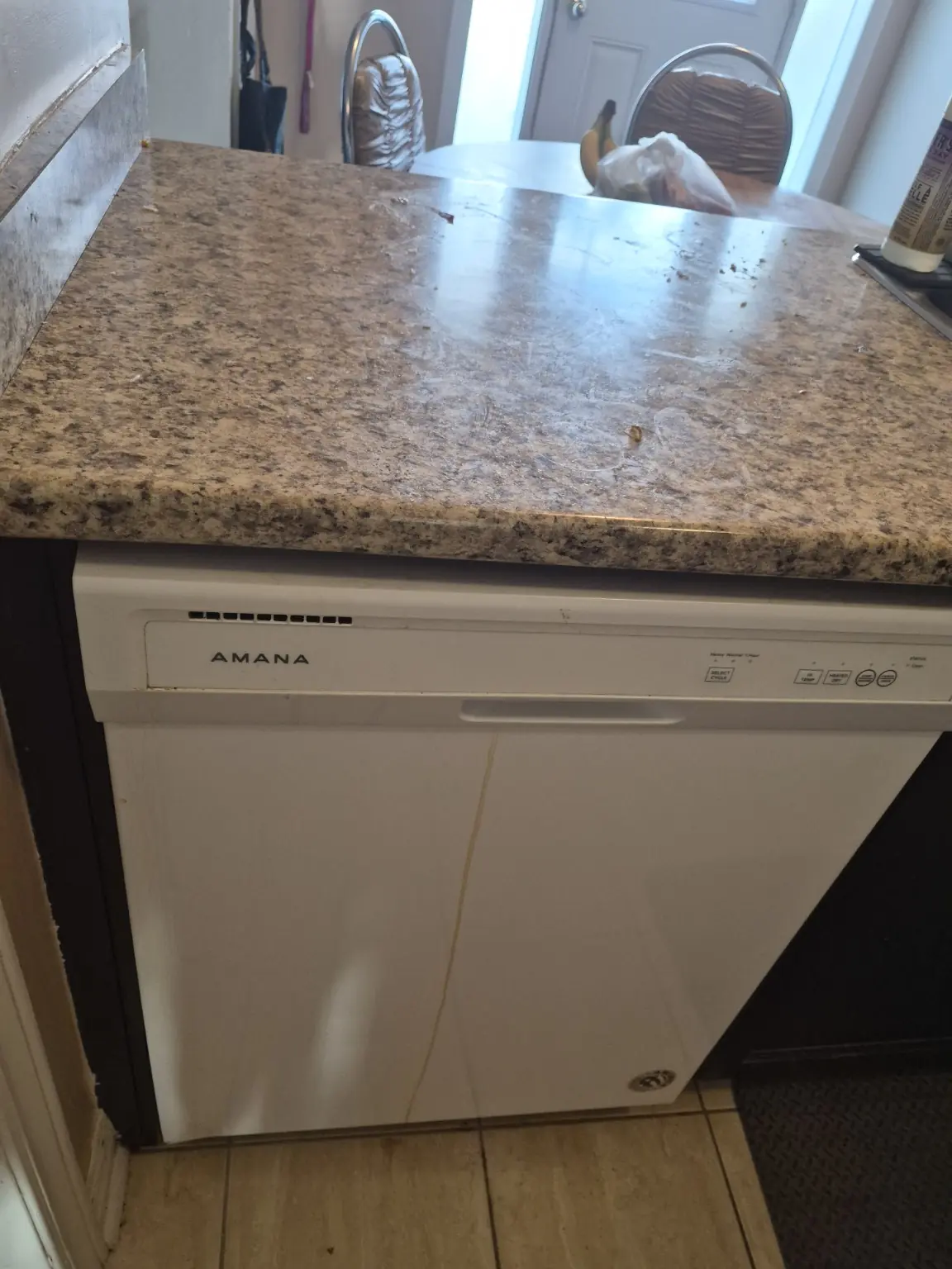 Dishwasher and countertop before a kitchen deep cleaning service in Pickering