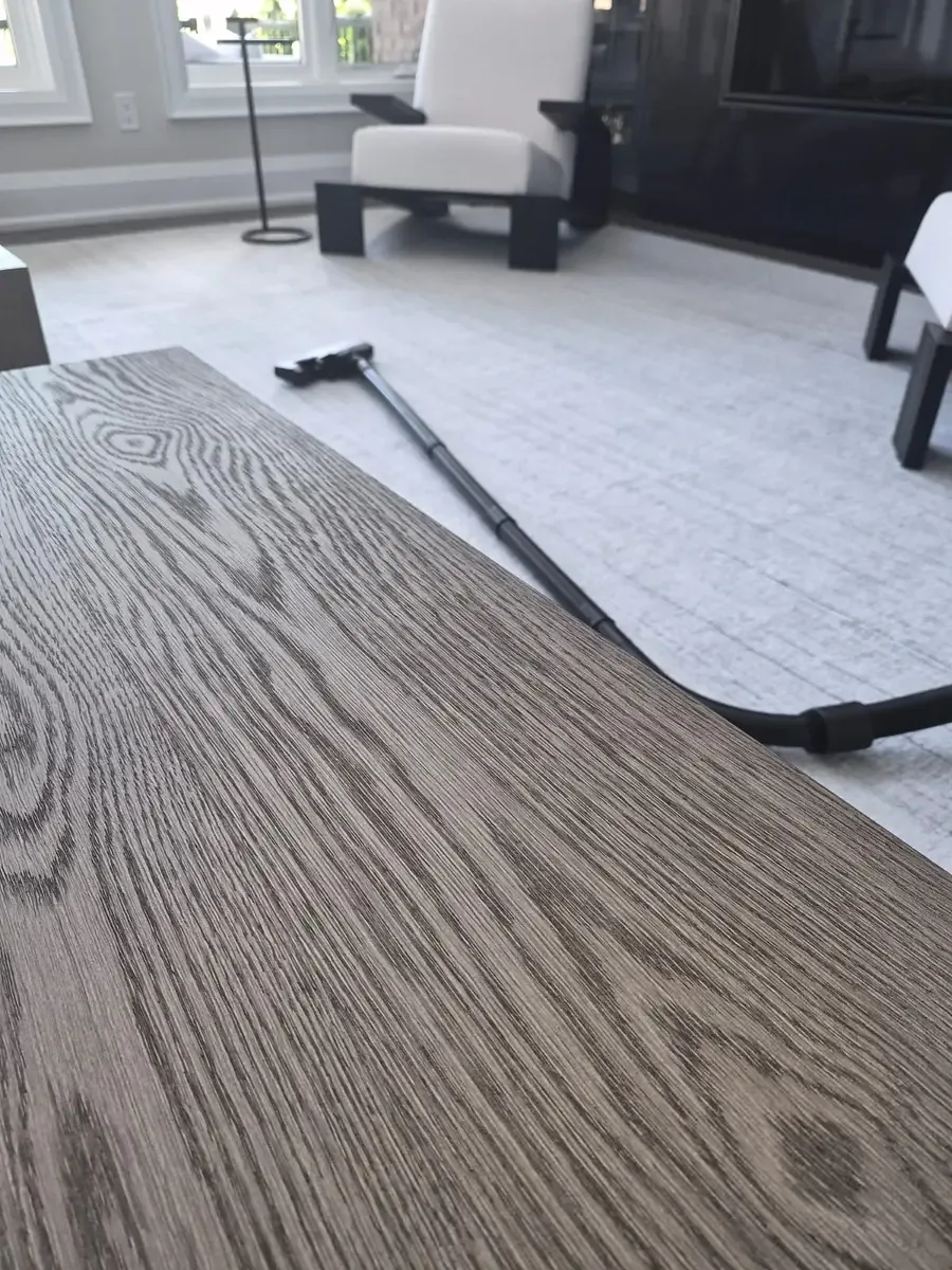 Family-room vacuuming completed during a weekly house cleaning service in Ajax, Ontario.